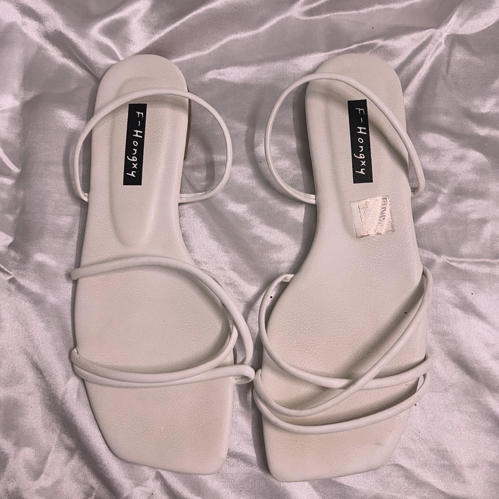 White strappy flats